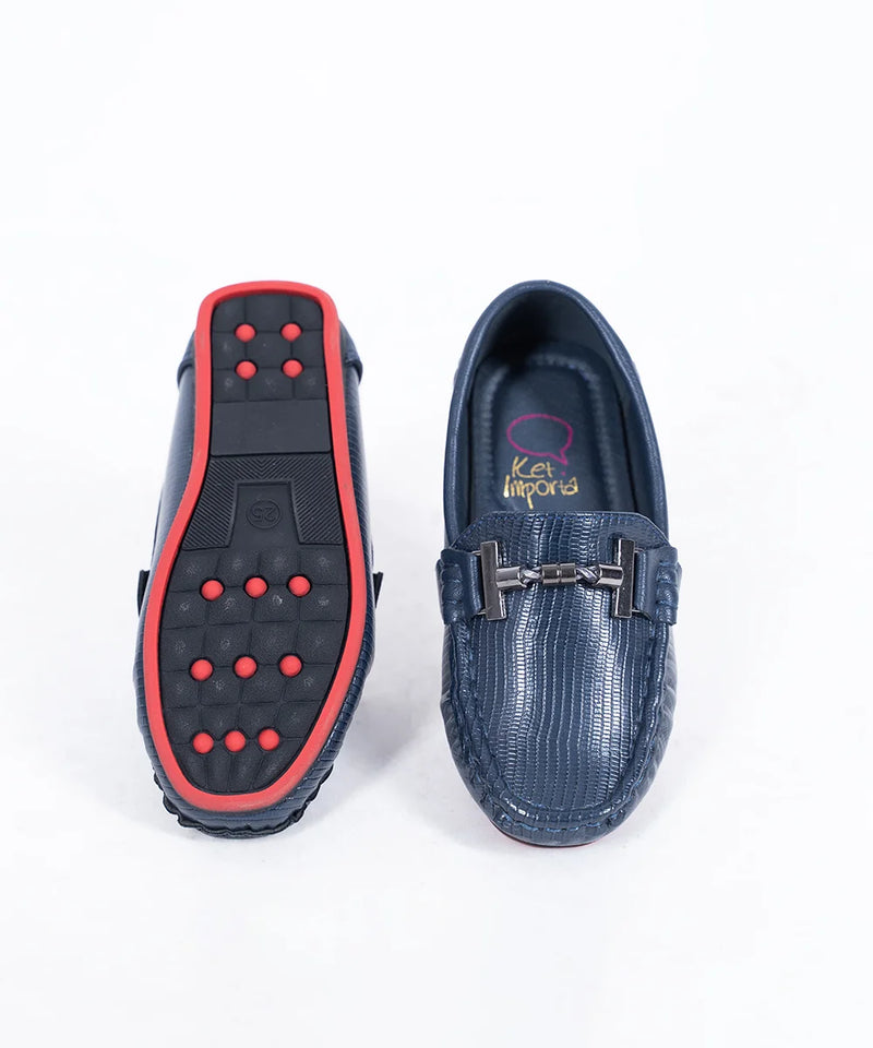 Close-up of trendy kids' navy blue party moccasins with cushioned insole and textured pattern, Jaipur

