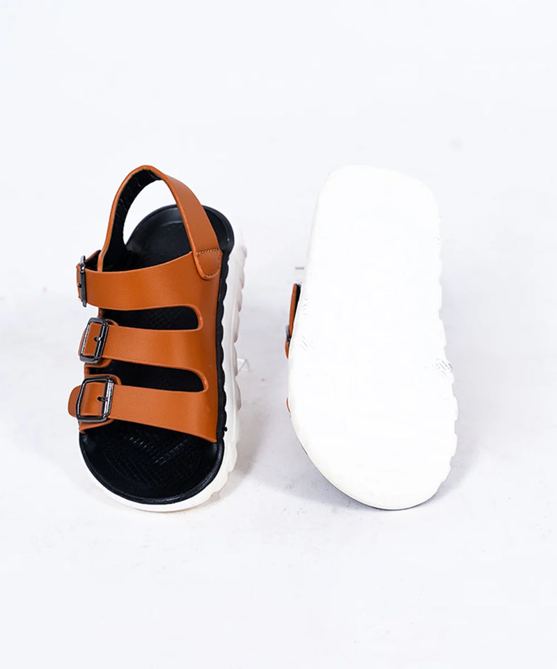 Close-up of trendy tan open-toe sandals for boys with metal buckles, Jaipur