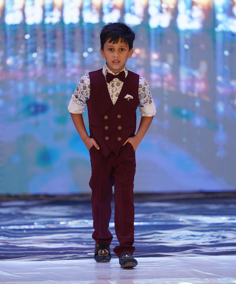 maroon waist coat, pants paired with printed shirt & a bow for boys 