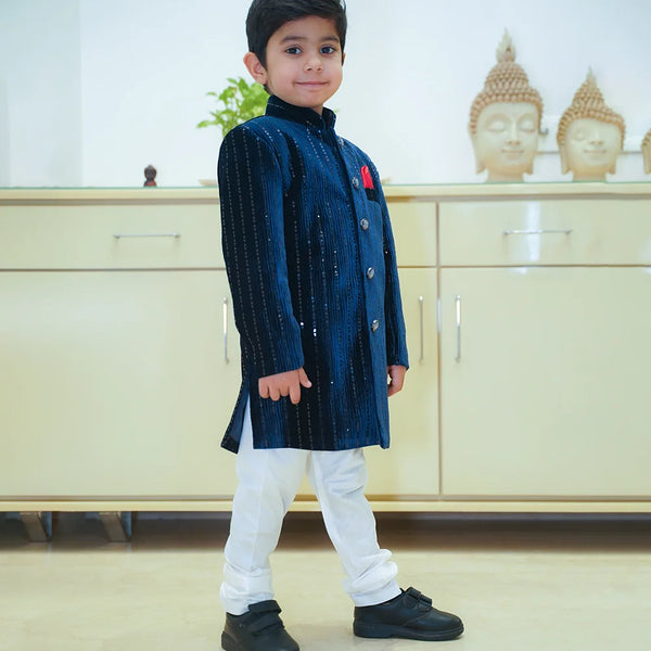 navy blue shimmer sherwani paired with white pajamas 