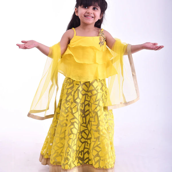 Yellow layered kids lehenga choli with floral lace, perfect for weddings in Jaipur