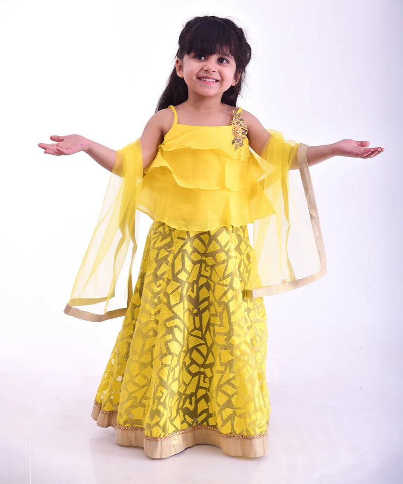 Yellow layered kids lehenga choli with floral lace, perfect for weddings in Jaipur